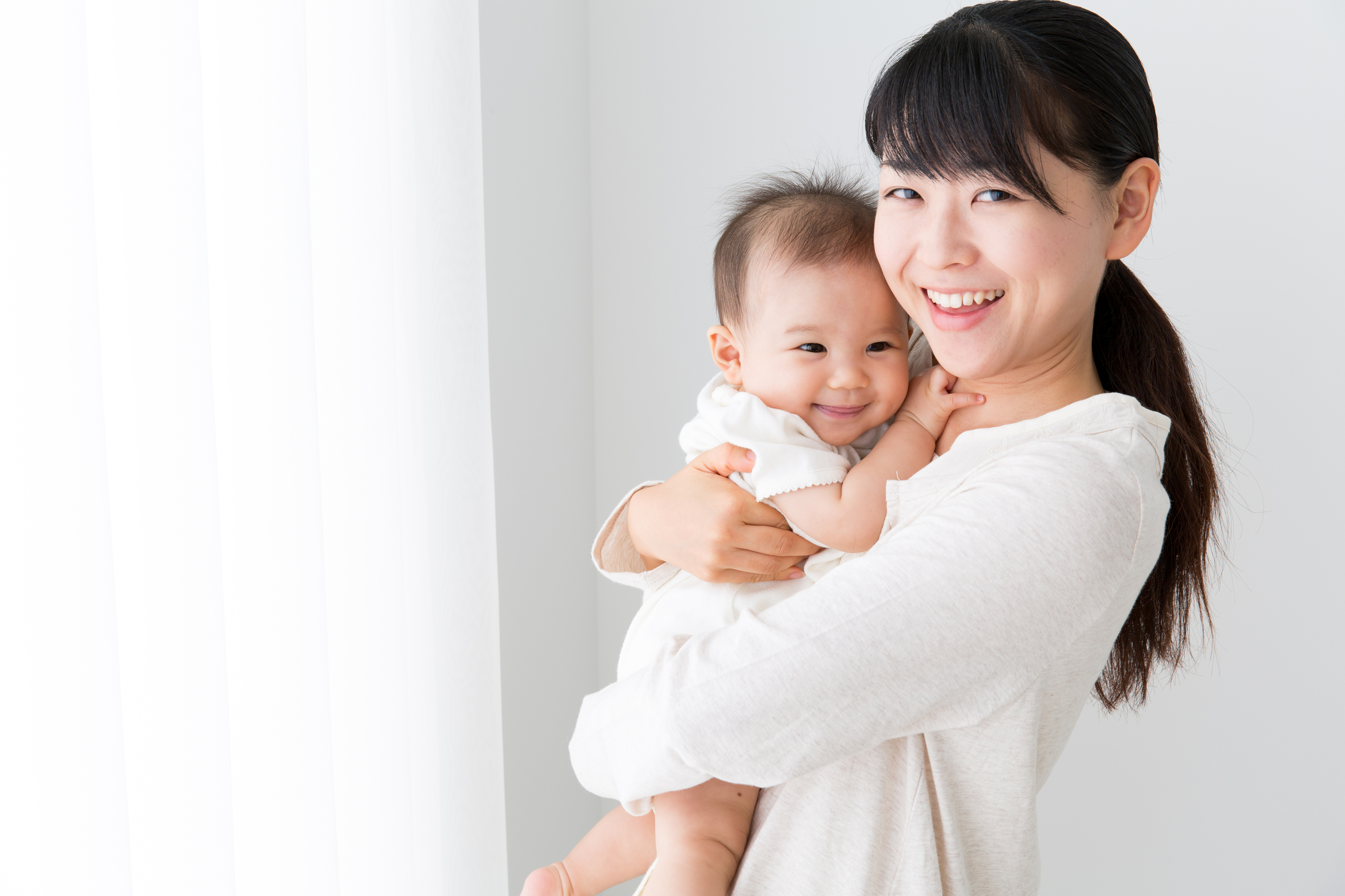 portrait of asian mother and baby in living room | GNR Public Health